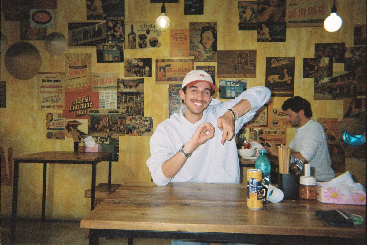 Cam at a restaurant table
